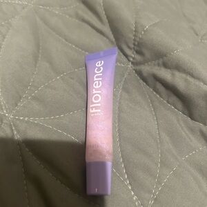 florence by mills plumping lip gloss clear with pink iridescent glitter